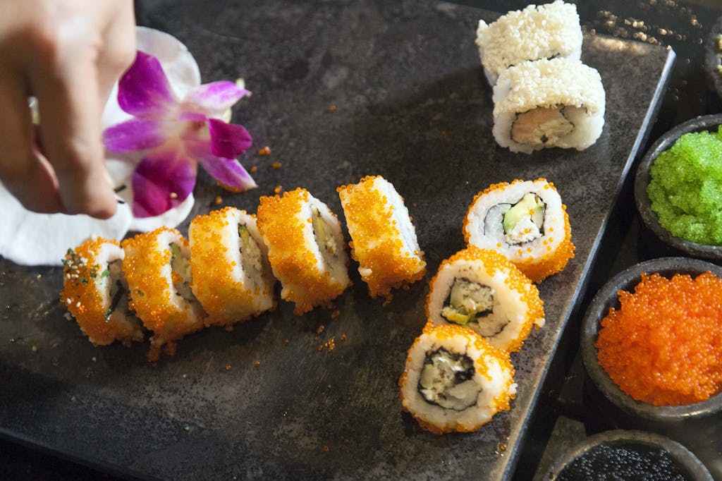 Properly cutting fish for sushi takes years of practice.