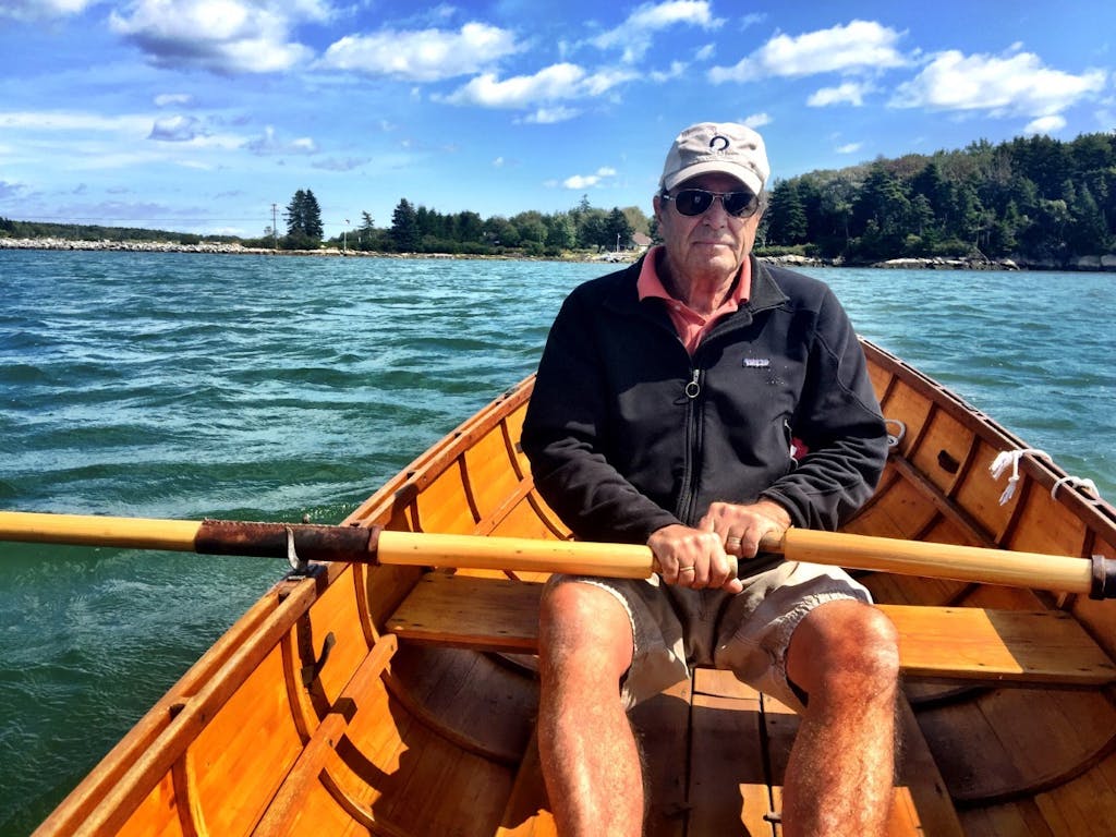Paul Theroux rowing in Maine